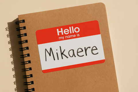 Close-up of a classroom name tag with "Mikaere" written on it in a child’s handwriting — symbolising the importance of learning and pronouncing Māori names correctly in educational settings.