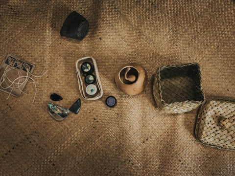 traditional maori birthing items lying on whariki