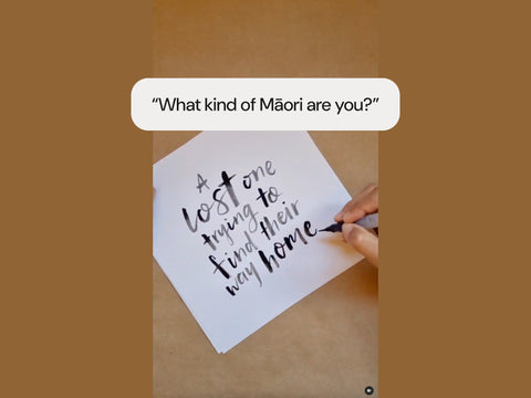 Hand lettering a quote 'A lost one trying to find their way home' on paper with the question 'What kind of Māori are you?' above