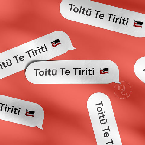 Multiple "Toitū Te Tiriti" vinyl decals on a bright red textured background, showcasing elegant design with the Māori tino rangatiratanga flag