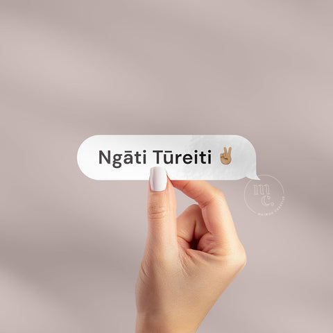 Hand holding 'Ngāti Tūreiti ✌🏽' Māori vinyl sticker decal on a plain background, showcasing the phrase and the peace sign emoji