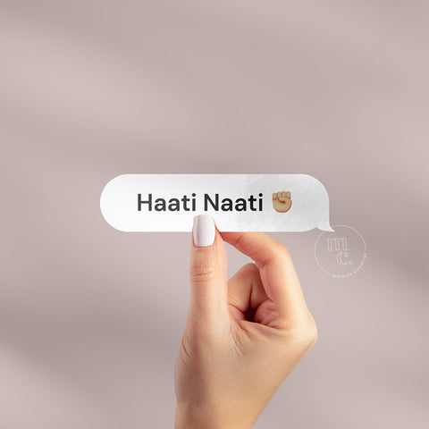 Hand holding 'Haati Naati ✊🏼' Māori vinyl sticker decal on a plain background, showcasing the phrase and the fist pump emoji