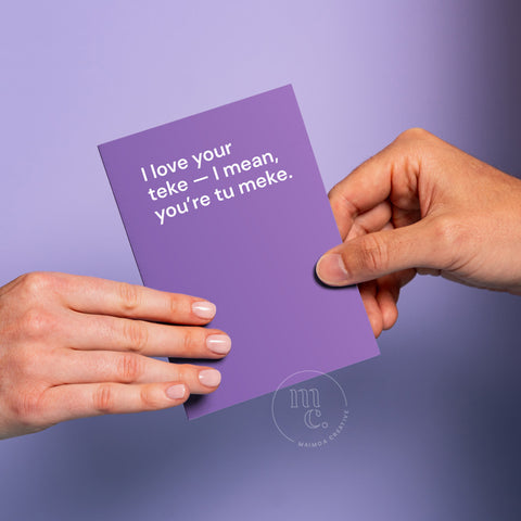 Hand passing an R18 greeting card with the text 'I love your teke — I mean, you’re tu meke.' on a pastel purple background