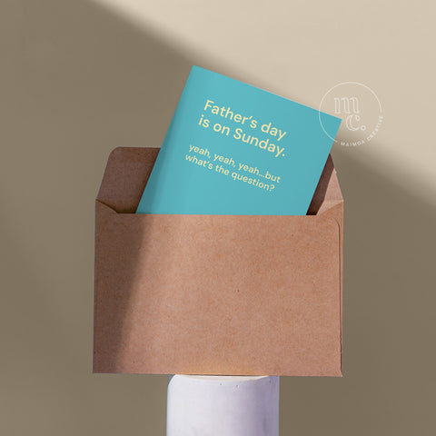 Father’s Day card peeking out of a kraft envelope, featuring the quote “Father’s day is on Sunday. yeah, yeah, yeah…but what’s the question?”