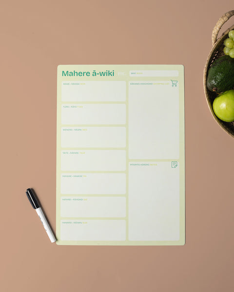 A3 green magnetic weekly planner with a whiteboard pen on a brown background
