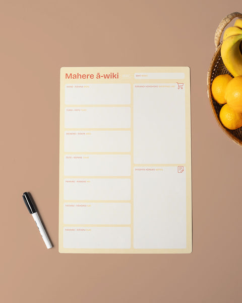 A3 yellow magnetic weekly planner with a whiteboard pen on a brown background