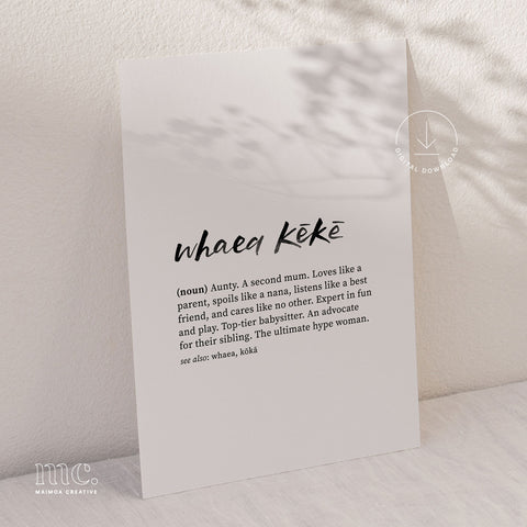 Print of 'Whaea Kēkē' definition in a minimalistic black font on a textured grey background, with gentle shadow patterns from nearby leaves.