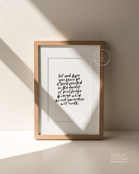 Framed print with motivational hand-lettered quote "let each kupu you learn be a seed planted in the forest of knowledge through which the next generation will walk" on a neutral background