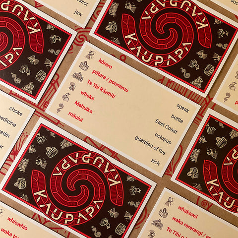 Assortment of Kaupapa game cards with Māori and English words.