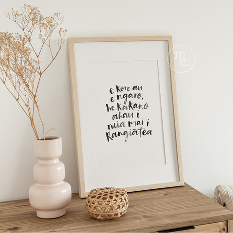A4 Māori art print with handwritten quote “E kore au e ngaro...” framed and styled in a modern, natural home setting.