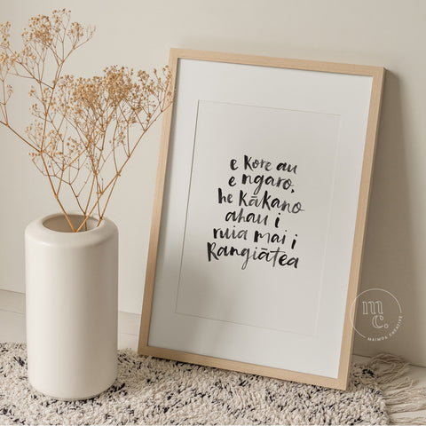 A4 Māori art print with handwritten quote “E kore au e ngaro...” framed and styled in a modern, natural home setting.