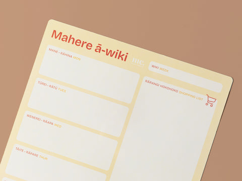 pastel yellow magnetic A3 weekly planner in te reo māori on a beige background