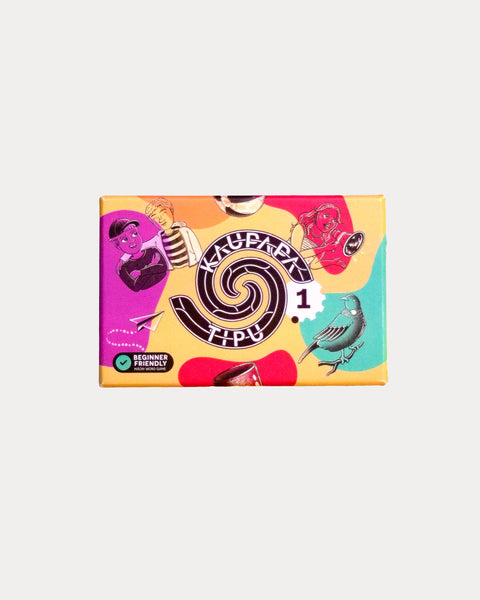 Colourful box from a reo Māori board game titled 'Kaupapa Tipu' on a light gray background