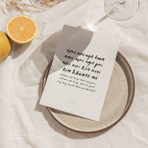 Digital download of "Nau mai ngā hua" print, a Māori blessing for prosperity and growth, presented on a picnic setup.