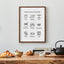 Framed 'Baking Terms in Te Reo Māori' displayed on a kitchen counter, complemented by fresh pastries, nuts, and a classic teapot, creating a warm and inviting baking scene.