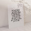 White card with black handlettered text "let each kupu you learn be a seed planted in the forest of knowledge through which the next generation will walk"