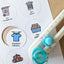 Round routine labels in te reo Māori with icons being cut out by a circle cutter tool