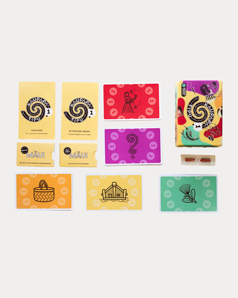 Set of colourful game elements from Kaupapa Tipu Game for learning te reo Māori including cards, instruction booklet and sand timer