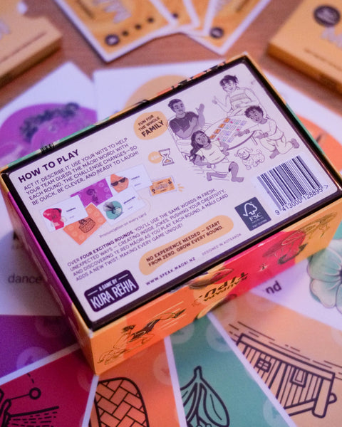 Card reo Māori game box with instructions and branding on a colourful card game surface