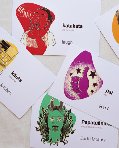 Collection of colourful cards with various illustrations with te reo Māori words and translations