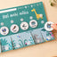 te reo māori flip chart with zoo animals and routine cards stuck on with velcro dots on a light background