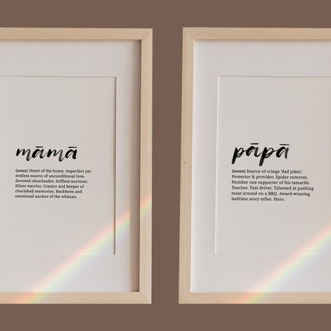 Framed prints defining "mama" and "papa" with heartwarming, humorous descriptions