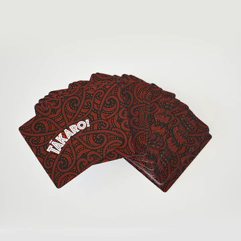 Red and black patterned playing cards with 'TAKARO' branding on a light gray background