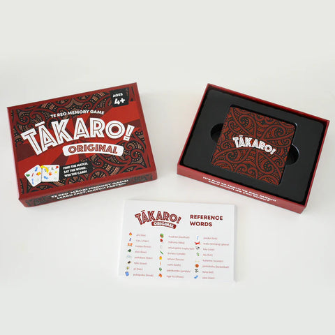 Tākaro! card game packaging with cards and reference sheet on a white background