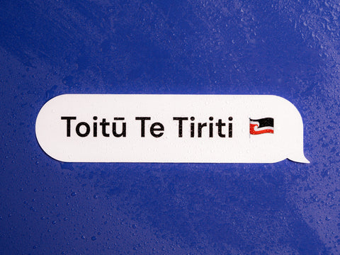 toitu te tiriti vinyl sticker with water droplets on it on a bright purple background